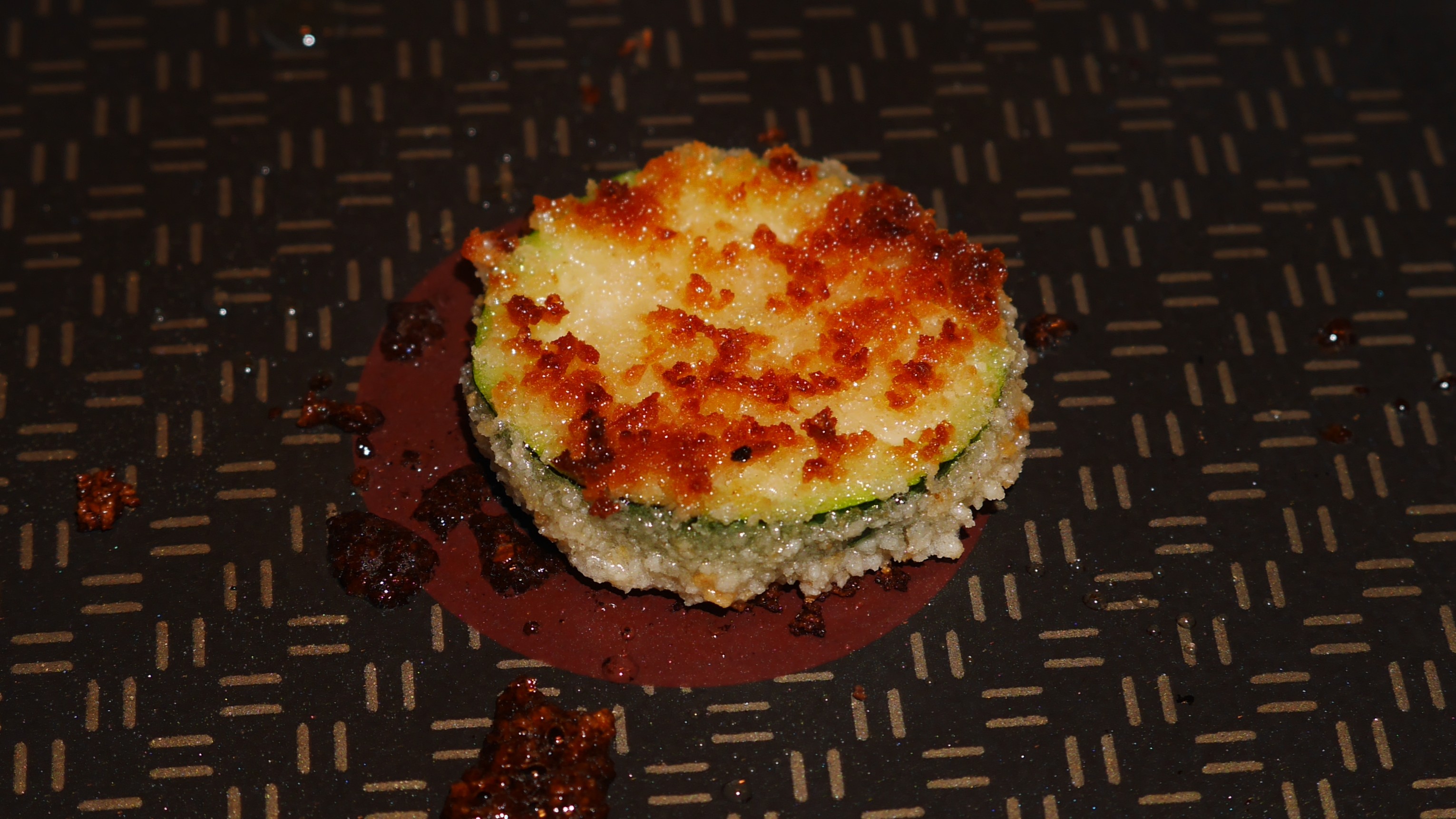 Nicely browned courgette fritter in a frying pan